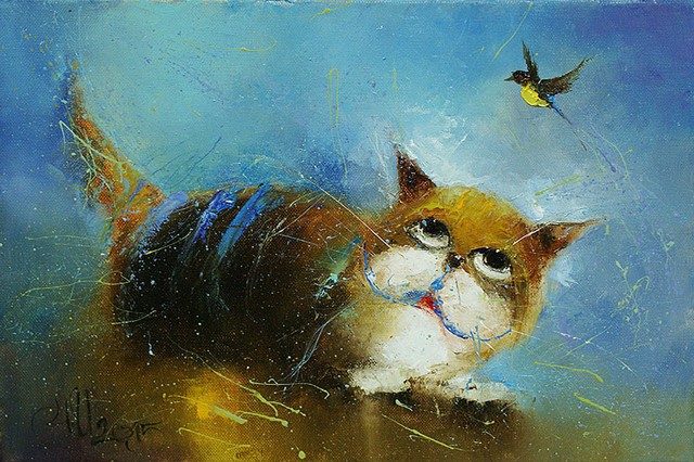 кот пытается поймать птичку